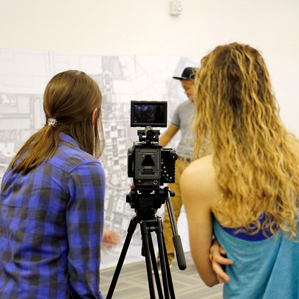 students filming video